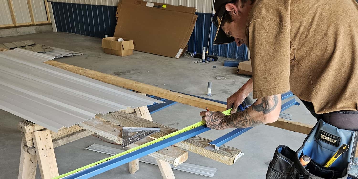 Commercial Construction Worker Marking a Measurement