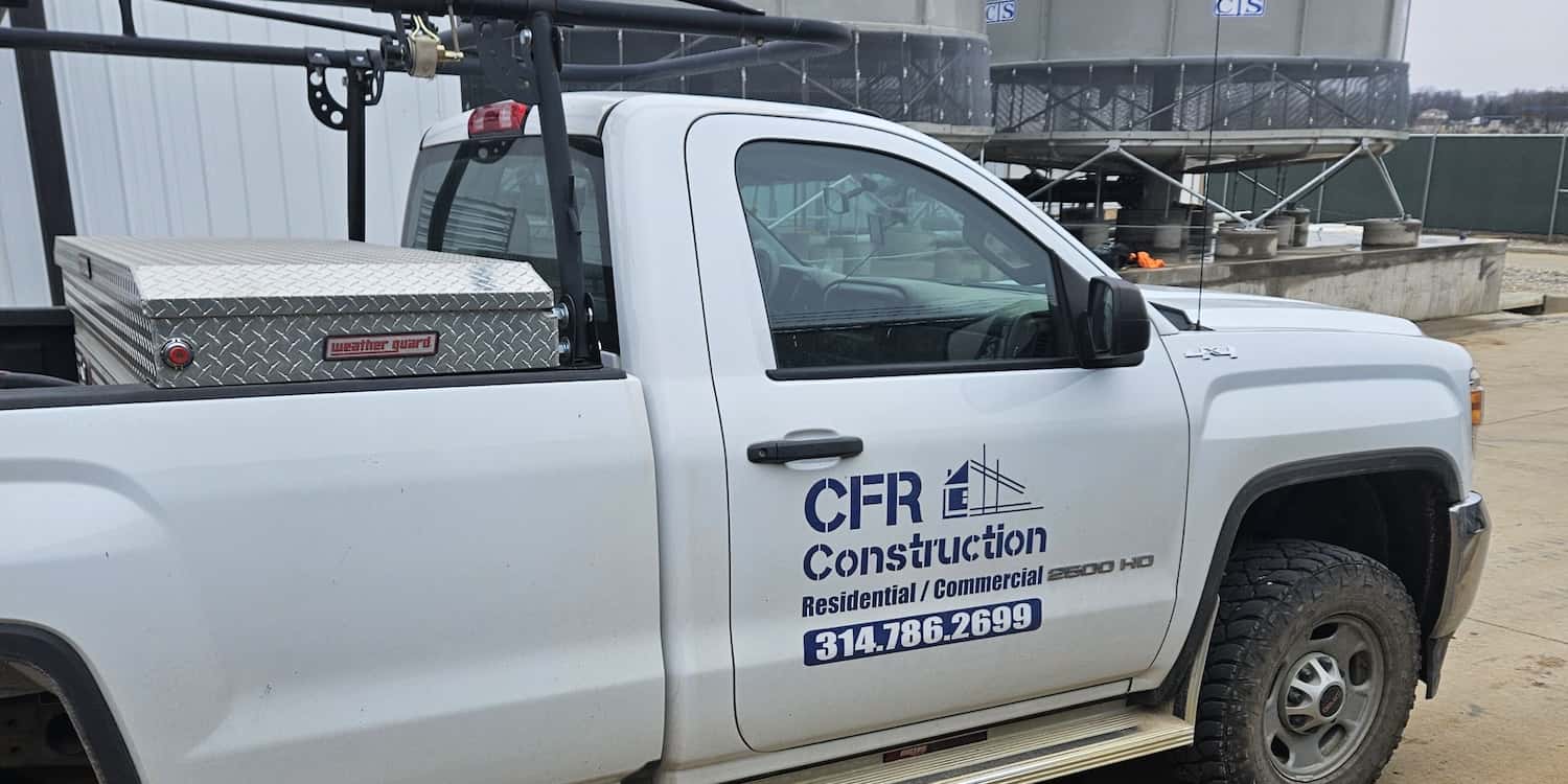 A CFR Construction truck with the CFR construction logo on the truck door