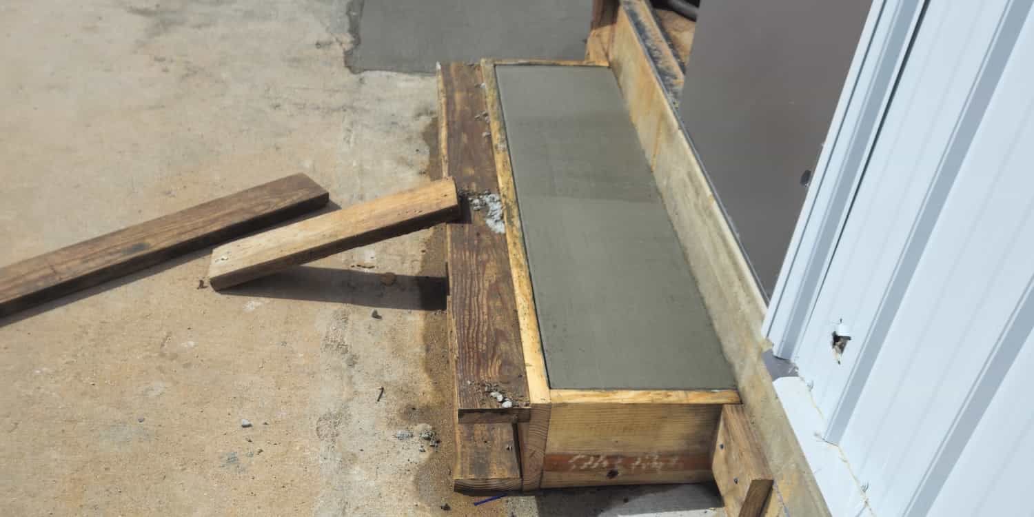 Concrete setting for a step to a house
