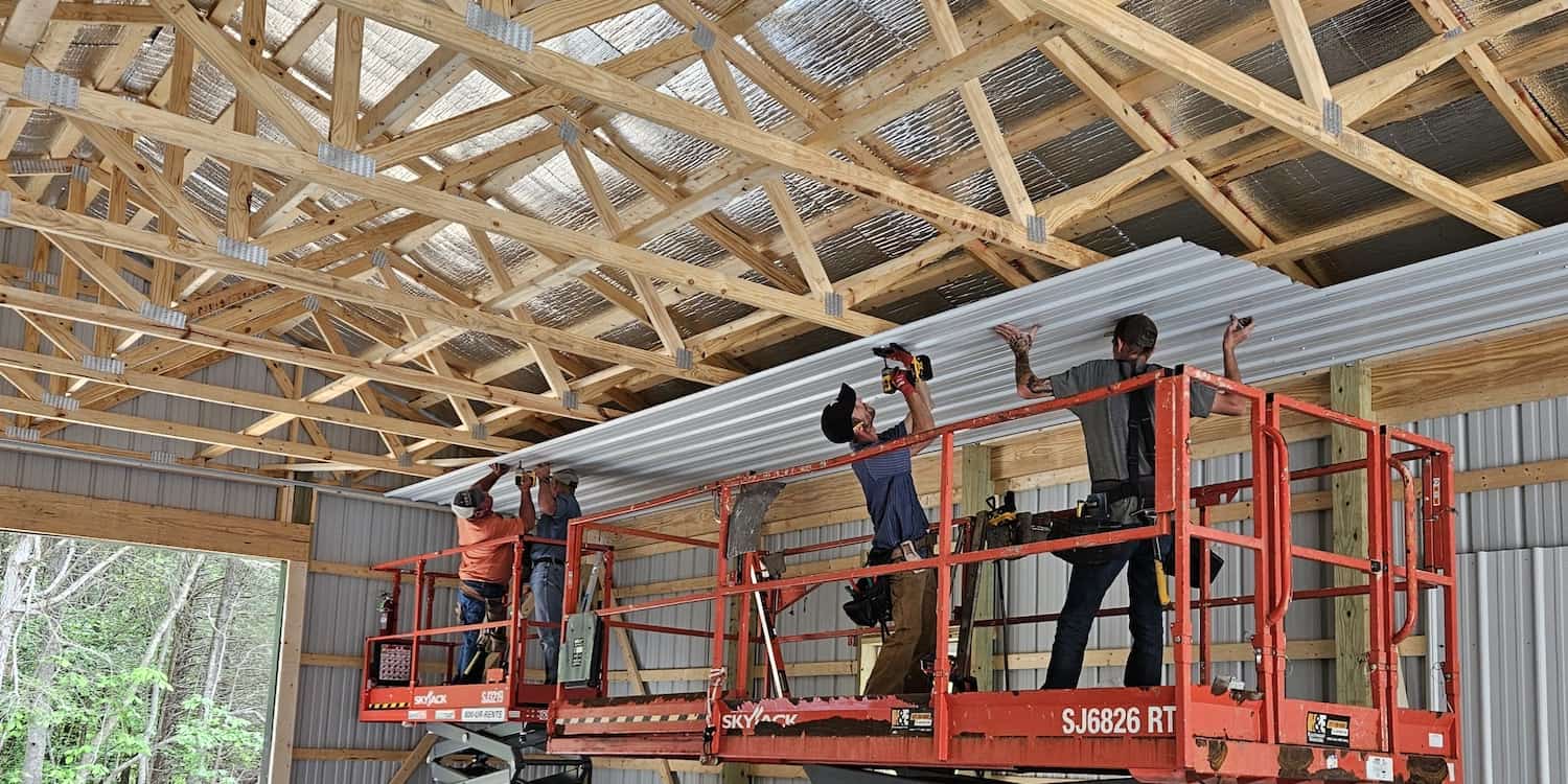 Two CFR construction employees building a commercial ceiling
