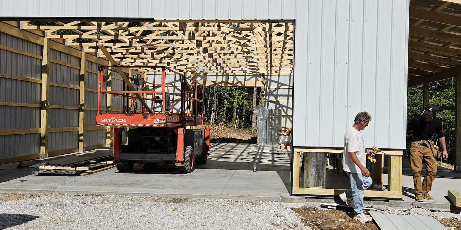 A construction site with workers walking around