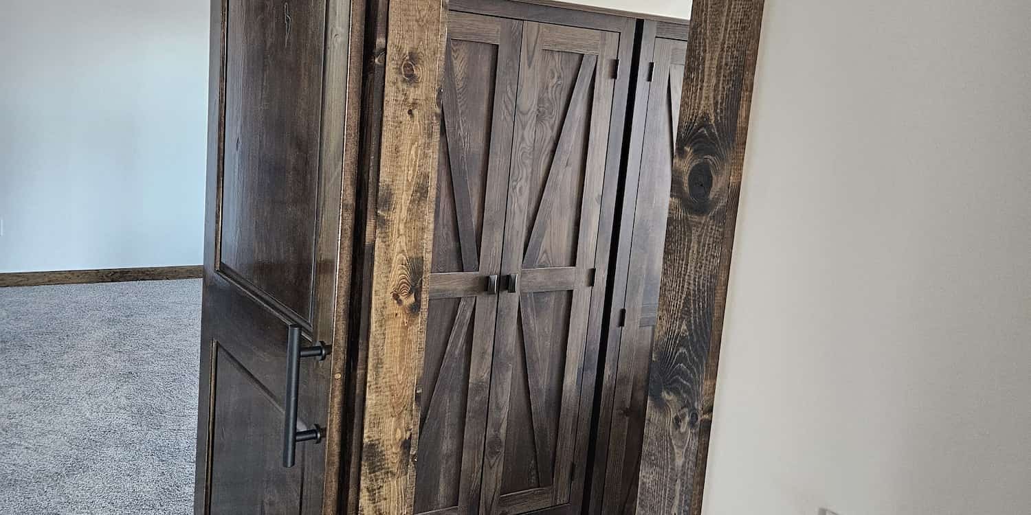 A brown door with black handles built by CFR Construction