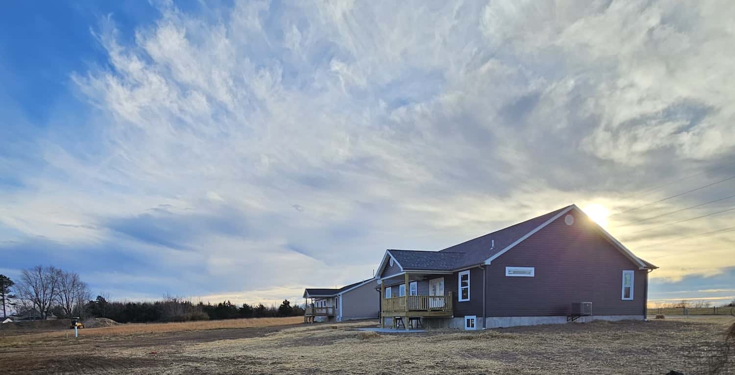 Two homes built by CFR Construction, with a nice sunset in the background